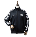 Abrigo Oasis x Adidas 2025