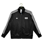 Abrigo Oasis x Adidas 2025